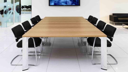 conference table in conference room with tv