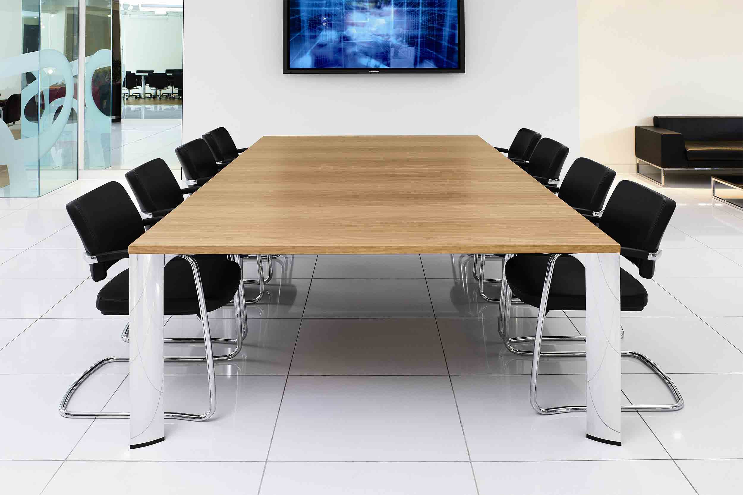 conference table in conference room with tv