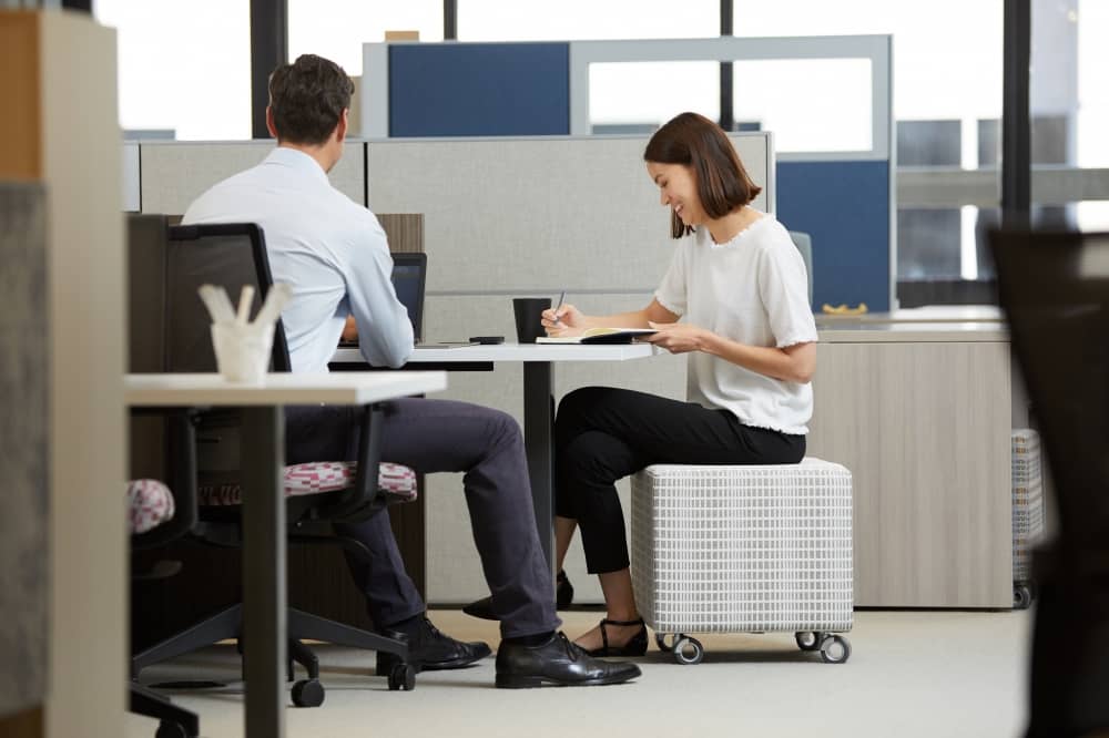 Man and woman working together in office setting