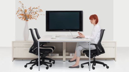 Woman sitting a desk