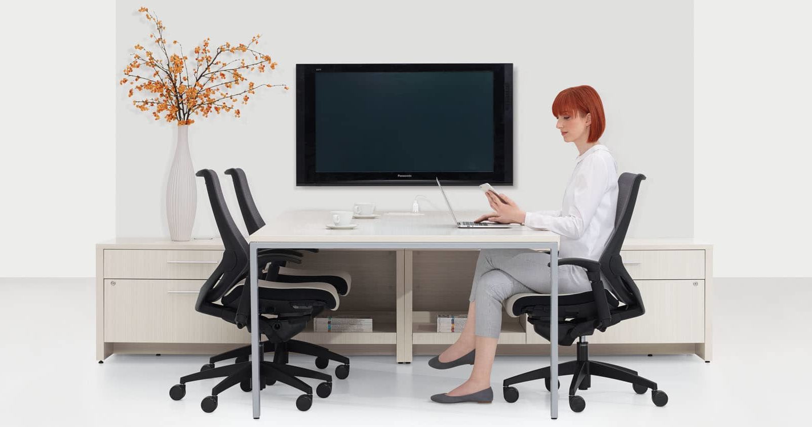 Woman sitting a desk