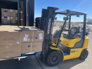 Forklift Loading Office Furniture into box truck